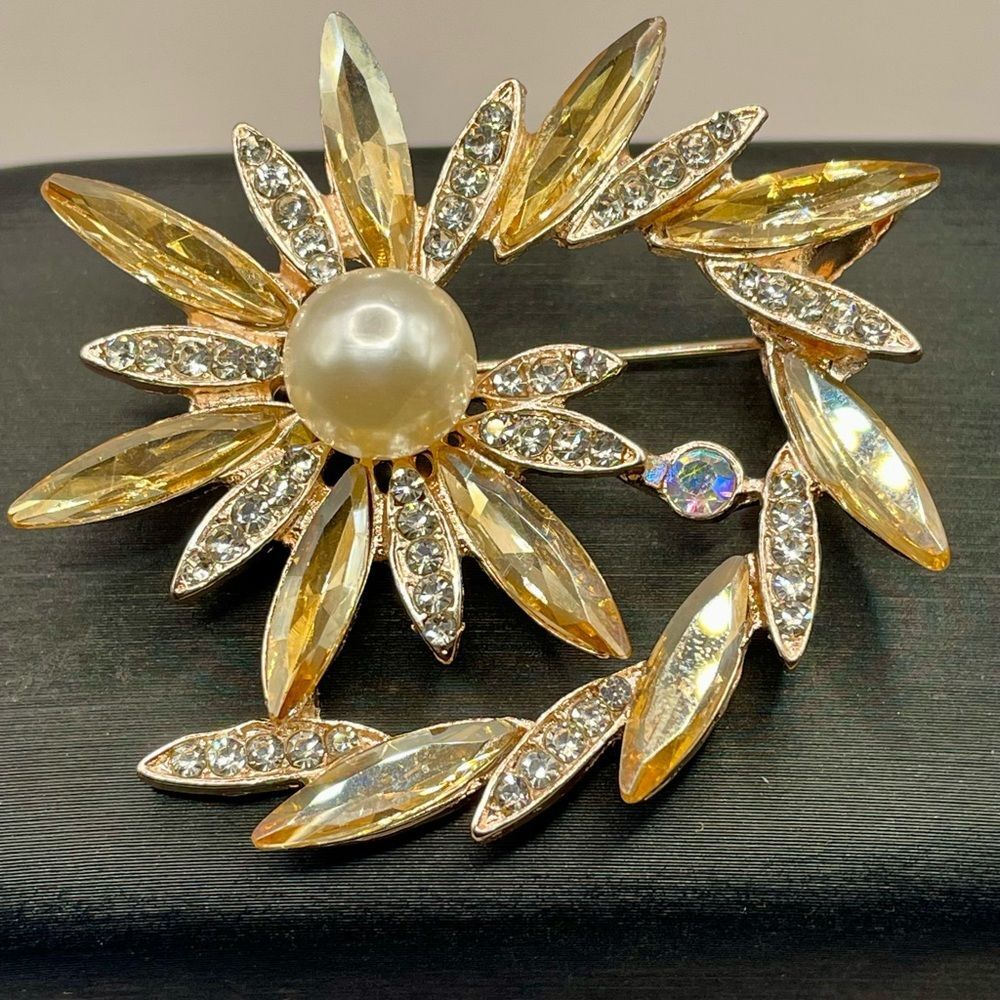 Elegant Gold Tone Floral Brooch with Rhinestones and Pearl Center